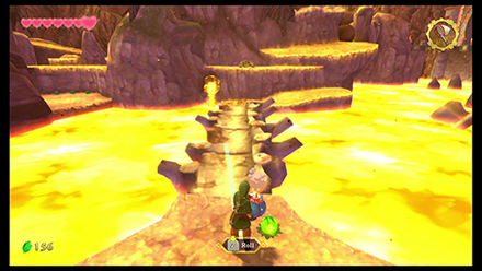 Use bomb flowers to clear the blockage and let the lava flow