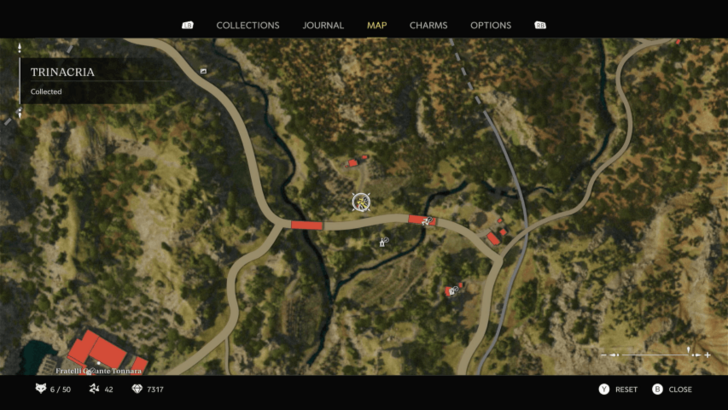 Trinacria 40 Found on top of a stone slab beside a small building with a green door that