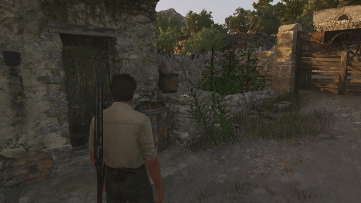 Trinacria 40 Found on top of a stone slab beside a small building with a green door that