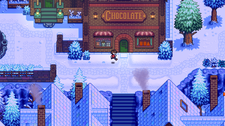 A still taken from Haunted Chocolatier shows the player character walking past a chocolate store in an otherwise empty town in the winter