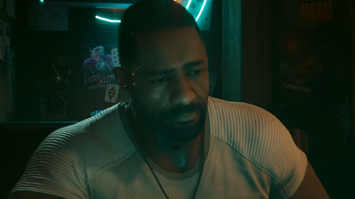Solomon Reed, played by Idris Elba, looking forlorn in shady Cyberpunk 2077 bar