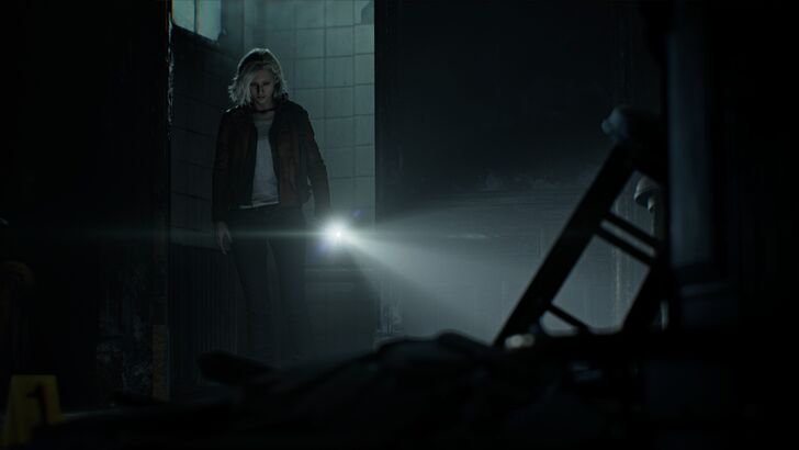 RE9 Grace Aschroft holding a flashlight