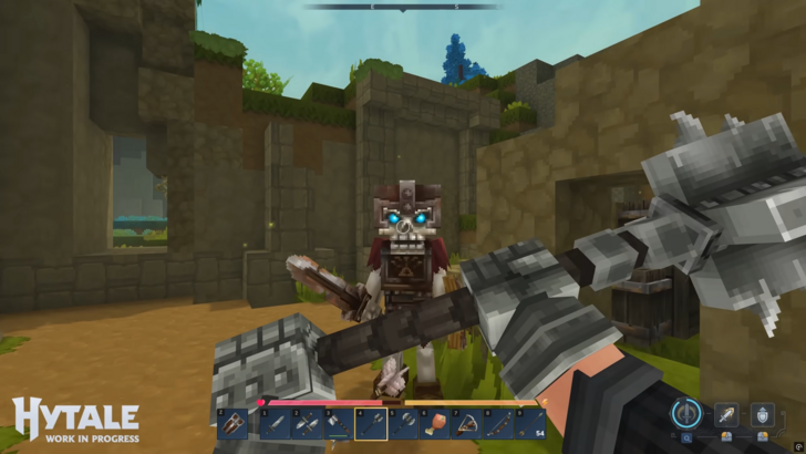 A Hytale player equipped with a mace faces off against a sword-wielding skeleton mob