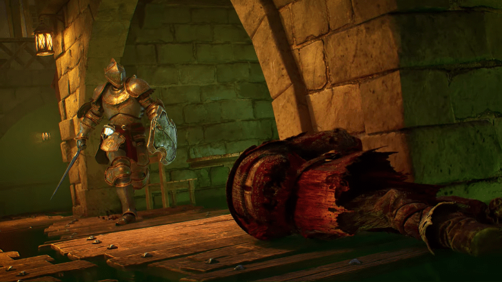 An image of an armored soldier approaching a body on the ground