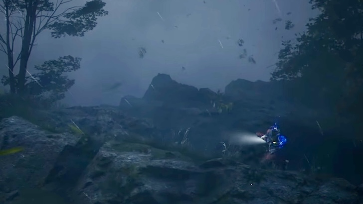 A Raider traverses rocky terrain amid heavy rain and wind