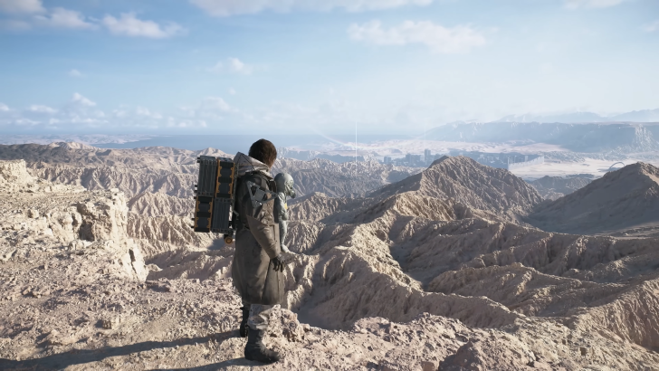 Death Stranding 2 On The Beach Sam Porter while holding Lou standing over a mountain range, daytime