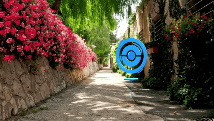 Pokémon GO Pokéstop in rural path with plants and pink flowers