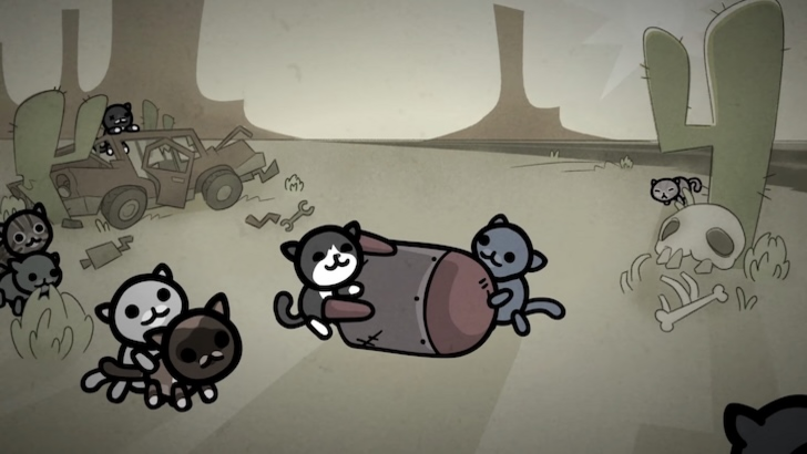 Cats playing with a large bomb