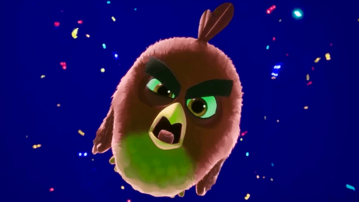 Red from Angry Birds floating mid-air with confetti