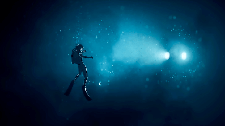 Diver looking at a submersible