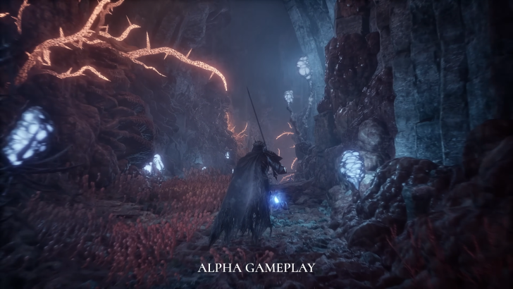 Lords of the Fallen 2 protagonist in full armour walking through a dark cave in the Umbral realm