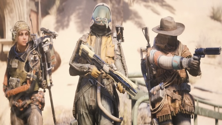 Three Raiders equipped with weapons and gear walk through a sandy environment