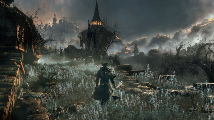 Bloodborne main character walking along a field with a tower just beyond