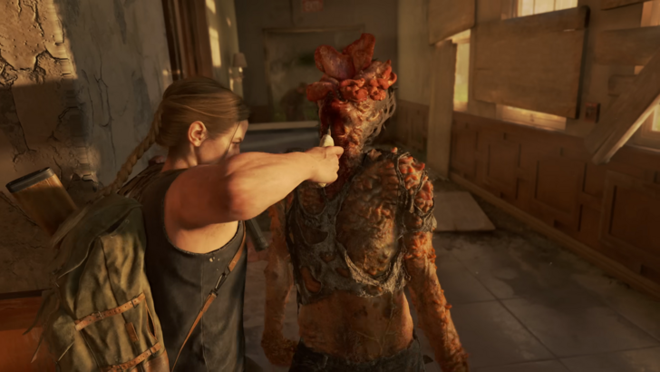 The Last of Us 2 Ellie attacking a zombie
