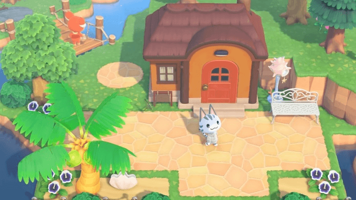 Lolly standing outside her house