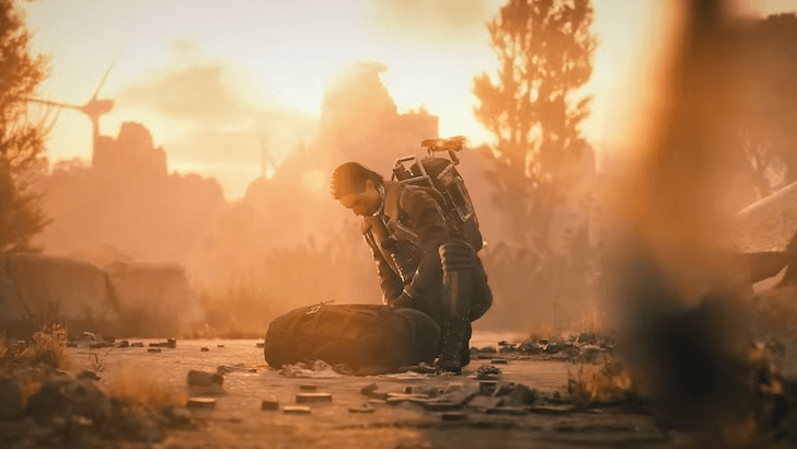 Raider kneeling beside a bag