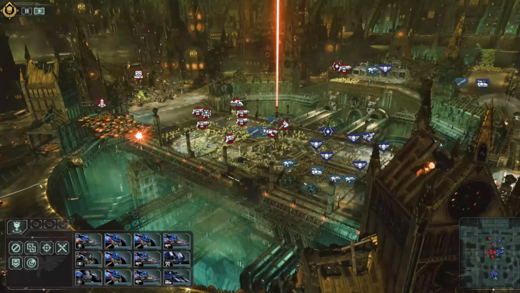 Total War: Warhammer 40,000 A battlefield showing Space Marines fighting against Orks across a ruined gothic city