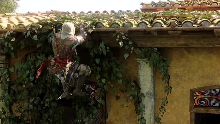 Edward hanging on roof of yellow house