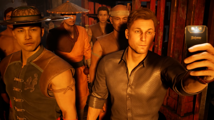 Mortal Kombat Johnny Cage holds up a phone for a selfie while standing beside Kung Lao and other fighters