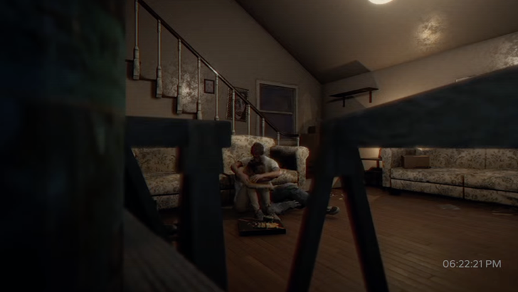 Daniel Stewart hugging Jessica Stewart sitting on floor of room with sofa with recording time in bottom right corner