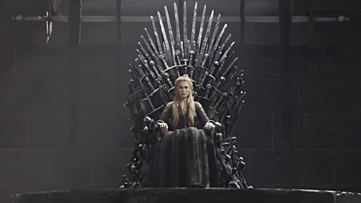 Cersei sitting on Iron Throne