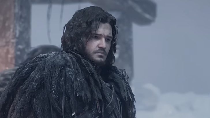 Jon Snow in black fur looking ahead