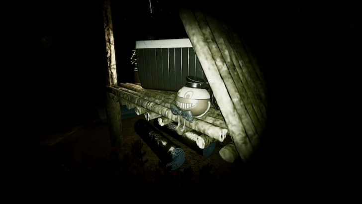 Flashlight pointed at a hidden figure beside stacked logs