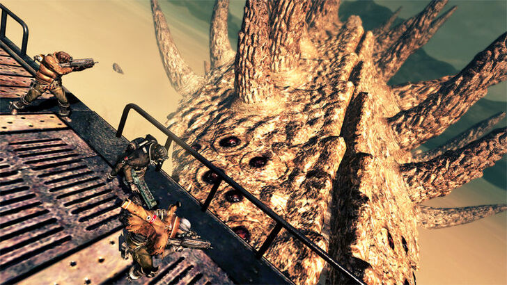 Lost Planet 2 Soldiers attacking a huge Akrid from a metal platform