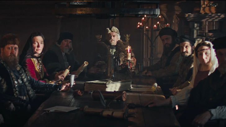 the guild europa 1410 merchants gathered around a wooden table