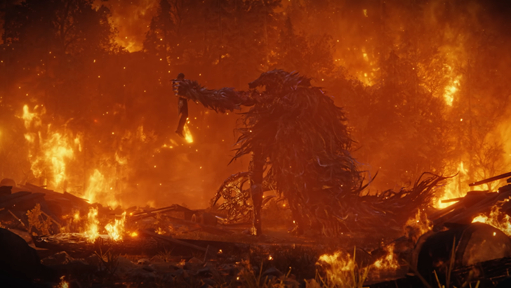 large creature holding smaller human by neck admist fire