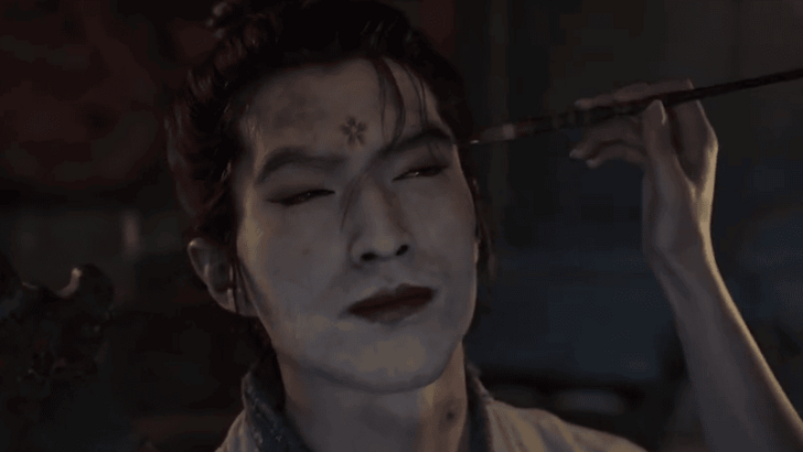 Man receiving traditional makeup