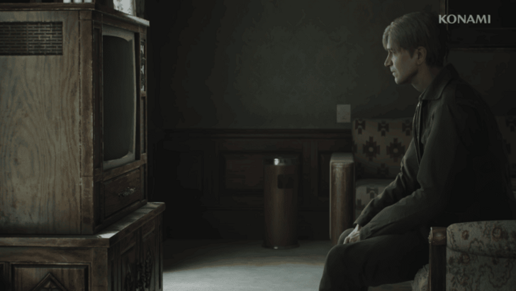 Pathetic man in an army jacket watching TV