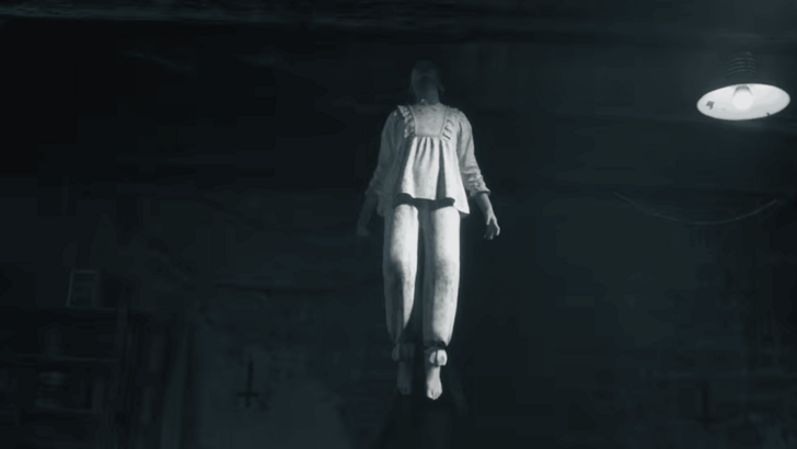 woman floating in a dark basement